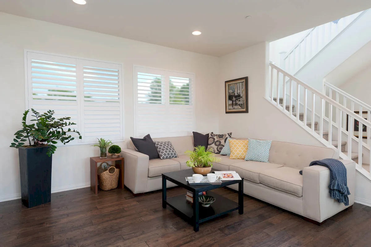 front room with interior custom plantation shutters made of wood