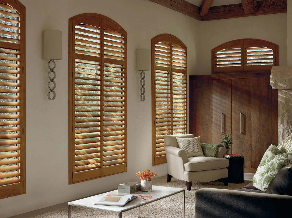 living room with interior custom plantation shutters made of wood