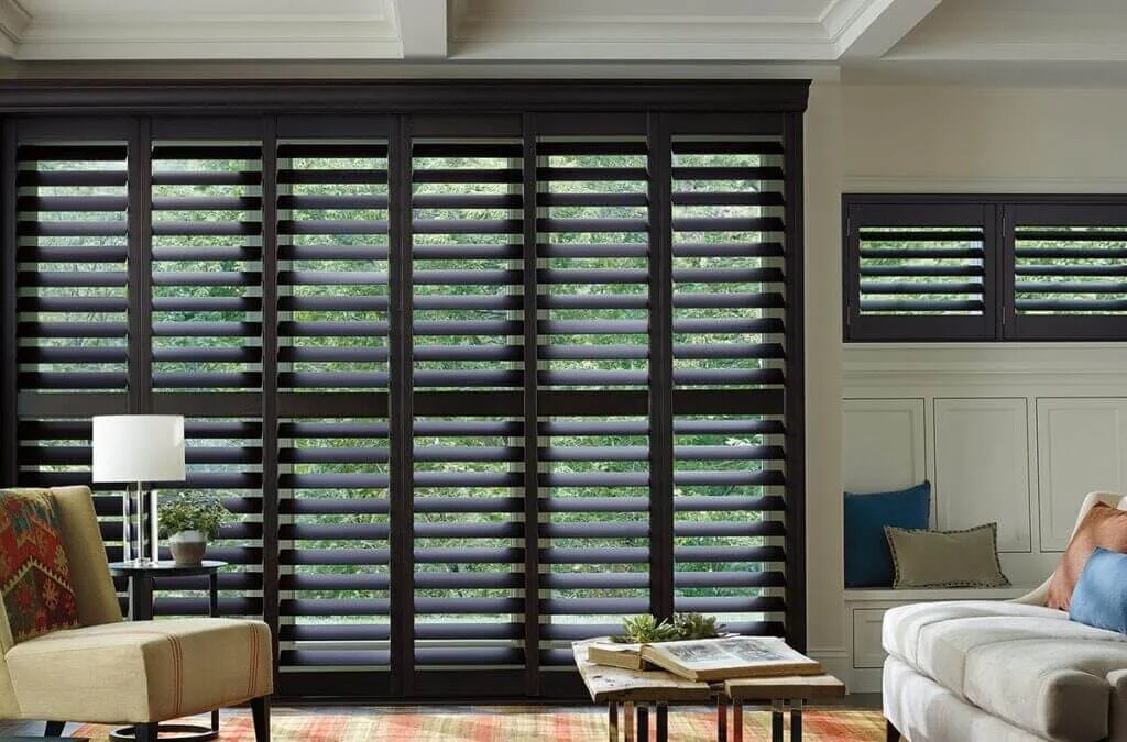living room with full-height interior custom plantation shutters made of wood