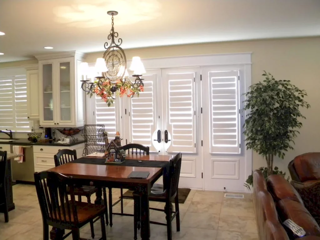 kitchen with indoor custom plantation shutters made of wood