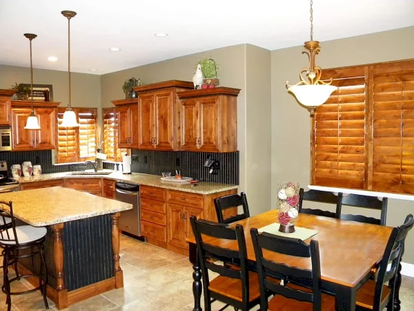 kitchen with indoor custom plantation shutters made of wood