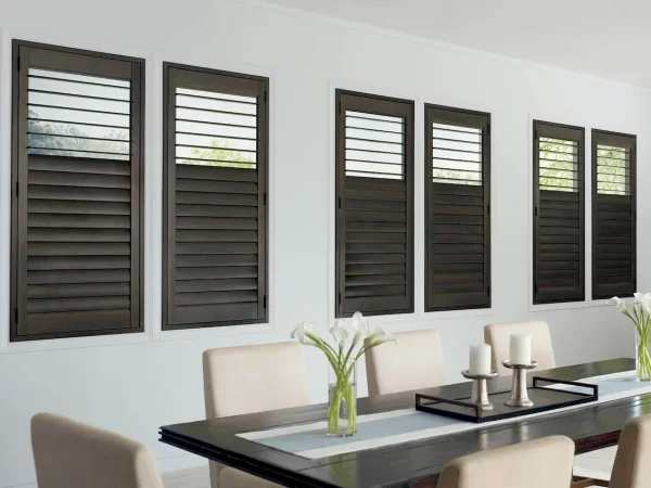 dining room with indoor custom plantation shutters made of wood