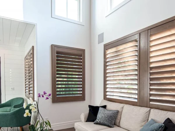 living room with inside custom plantation shutters made of wood